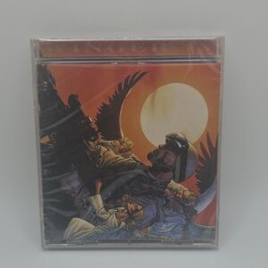 Vintage Rock/Metal Cassette Tape with Orange Sunset Artwork